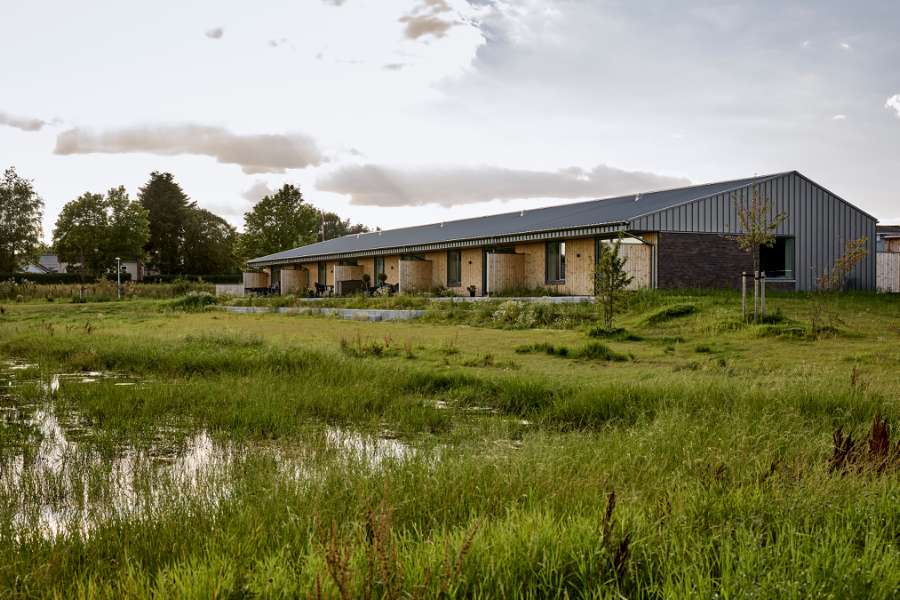 Past and future meet in steel-clad terraced houses with history in the backyard, Jernaldervej 8, 8600 Silkeborg, Denmark